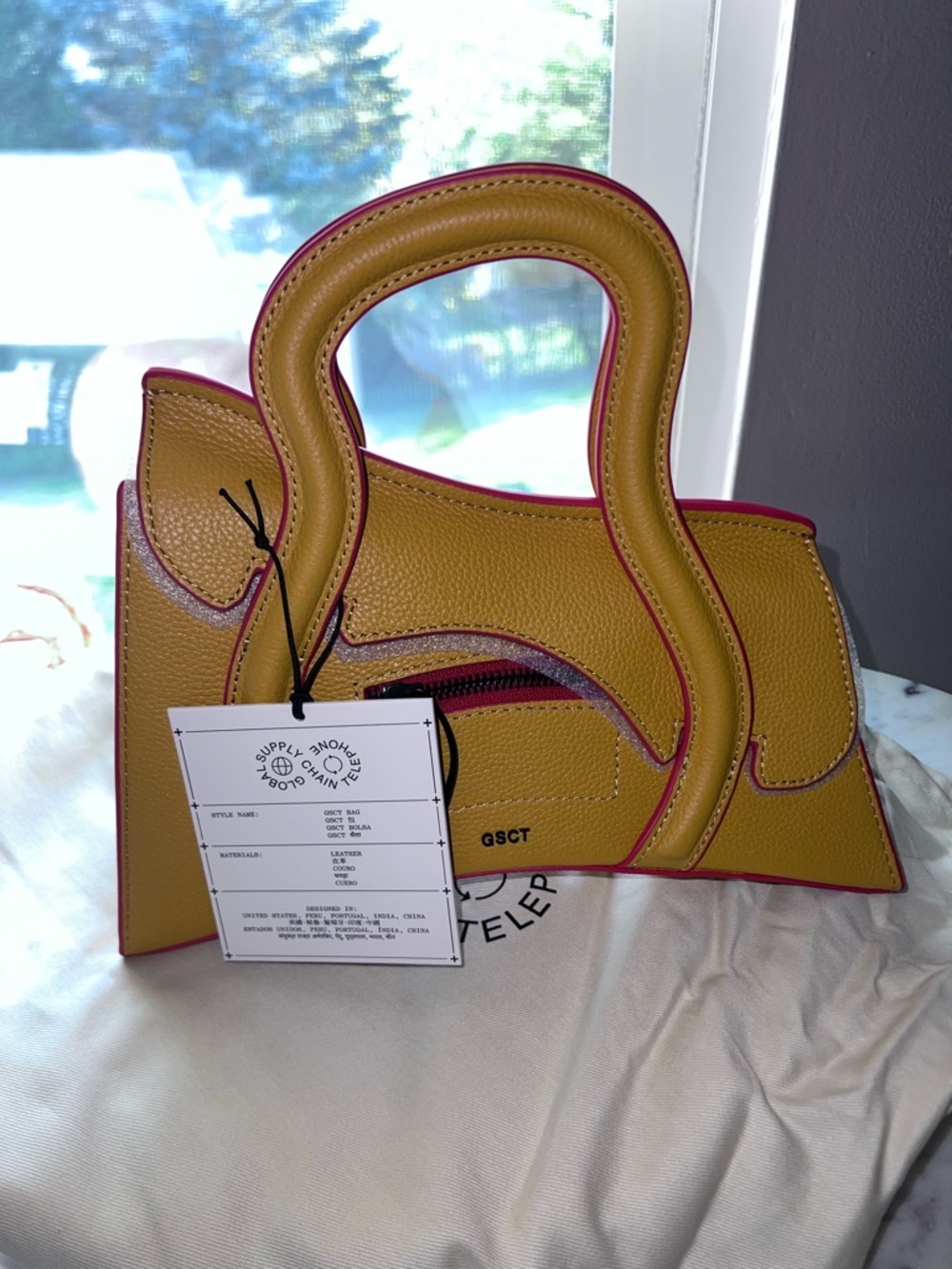 Pebbled Yellow Crossbody Bag with Sculptural Handle - Picture 10 of 14